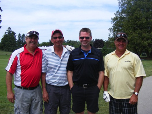 It's all smiles for the Walkerton area foursome of Ron Kroeplin, Tom Lang, Kevin Graf and Roger Fell who knocked off nine consecutive pars in the WDSS Reunion golf tournament as part of the "Back for the Future" weekend.